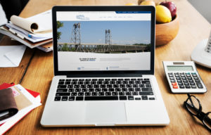 Wohlenberg Ritzman & Co website mocked up on a laptop.